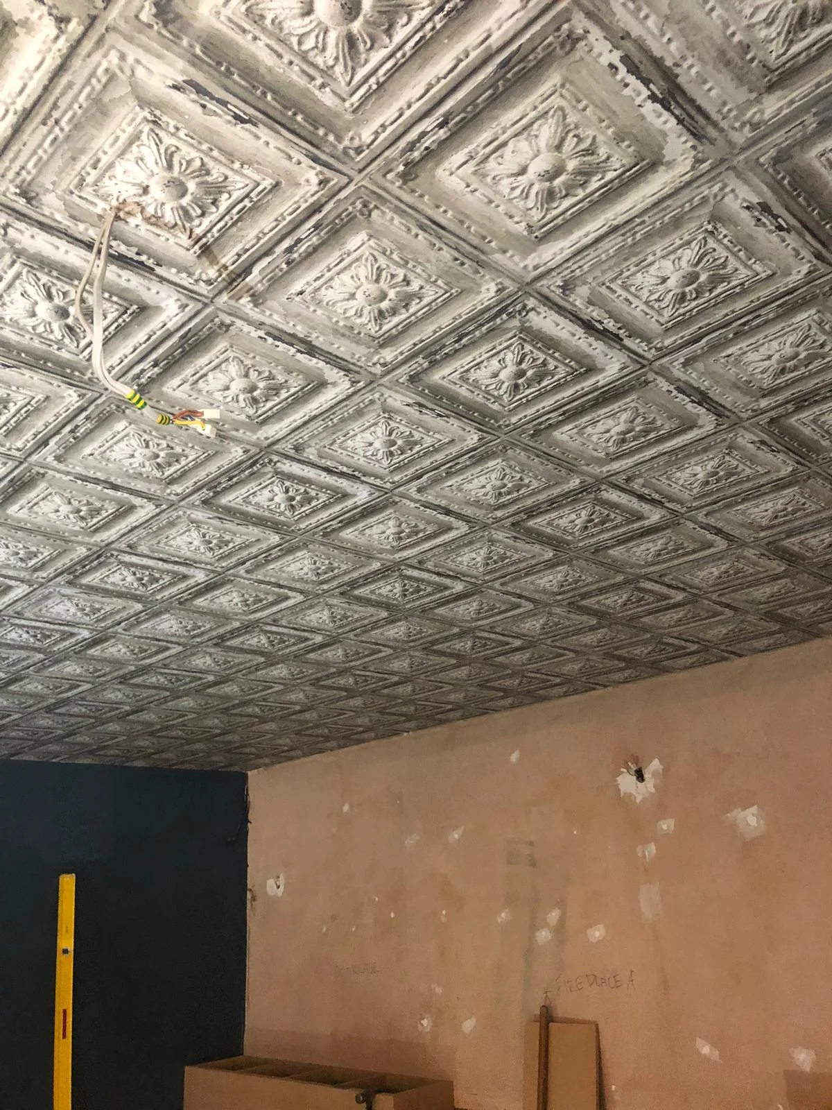 Ornate decorative tin ceiling restoration and painting — commercial property